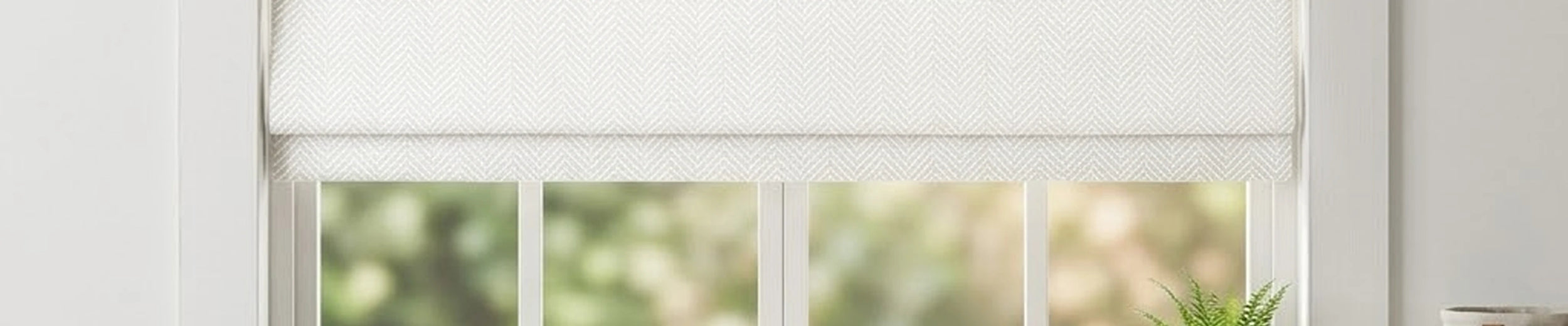 Orion blackout Roman shades in a softly styled neutral room